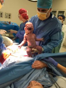 Dr Sykes Performing Caesarean Section